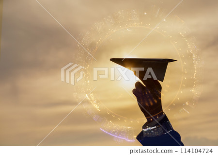 Double exposure of a paper airplane and a city panorama. 114104724
