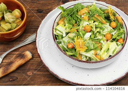 Salad with physalis and field grass 114104816