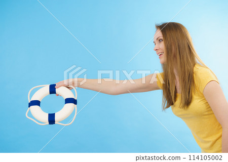 Girl holds life buoy rescue ring Girl holds life buoy rescue ring 114105002