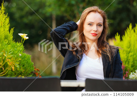 Woman waiting in outdoor restaurant cafe. Woman waiting in outdoor restaurant cafe. 114105009