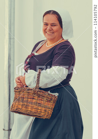 Portrait of brunette woman dressed in historical Baroque clothes with old fashion hairstyle Portrait of brunette woman dressed in historical Baroque clothes with old fashion hairstyle 114105792
