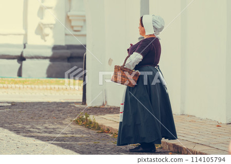 Portrait of brunette woman dressed in historical Baroque clothes with old fashion hairstyle Portrait of brunette woman dressed in historical Baroque clothes with old fashion hairstyle 114105794