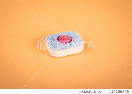 Dishwasher capsule on a light background. Housework and household appliances 114106206