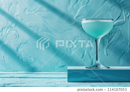 An azure fluid in a glass on azure background 114107053