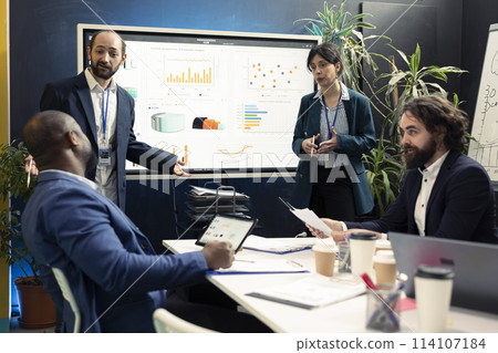 Public relations team working to improve the organization social media image, attending an executive meeting. Following trend updates and making decisions to corelate with company goals. 114107184