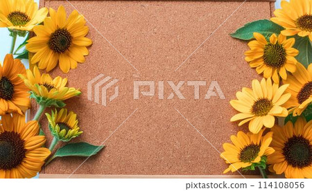 Sunflowers and corkboard 114108056