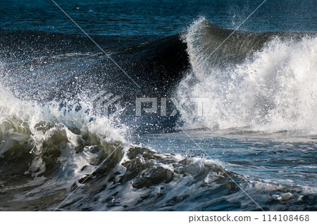 Closeup of waves whitewash splashing around Closeup of waves whitewash splashing around 114108468