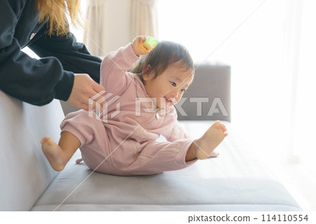 Smiling baby playing with mom 114110554