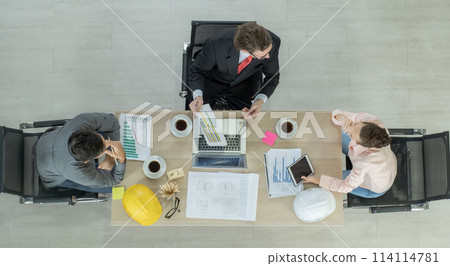 Engineer team meeting to inspect the construction blueprint drawings, work plan and distribute work before starting the building 114114781