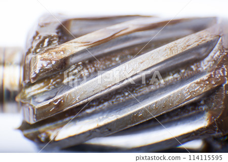 macro shot of a worm gear gear lubricated with grease. industry and industry. macro shot of a worm gear gear lubricated with grease. industry and industry. 114115595