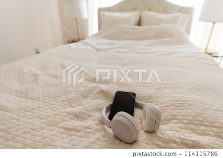 White bed in a bright room White bed in a bright room 114115786