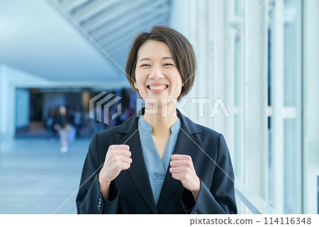 Business woman doing a fist pump 114116348