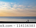Shonan coast in the early morning, the silhouette of a person walking a dog with the calm Pacific Ocean in the background was impressive. Shonan coast in the early morning, the silhouette of a person walking a dog with the calm Pacific Ocean in the background was impressive. 114116383
