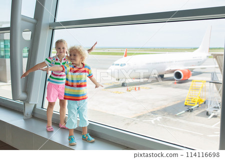 Kids travel and fly. Child at airplane in airport 114116698