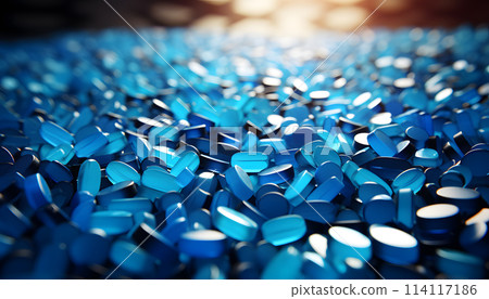 White pills on blue background 114117186