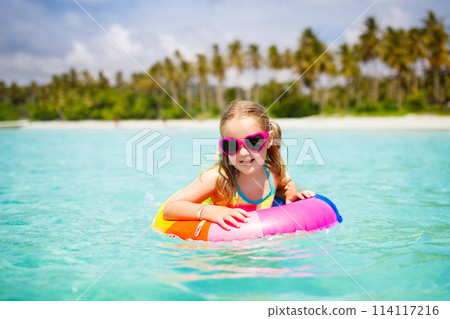 Child on tropical beach. Sea vacation with kids. 114117216