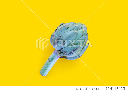 Fresh artichoke on yellow background. 114117425