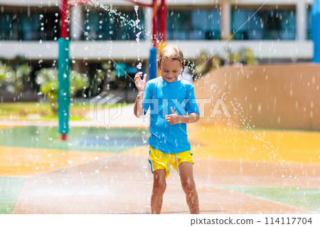 Kids on water slide in aqua park. Summer vacation 114117704