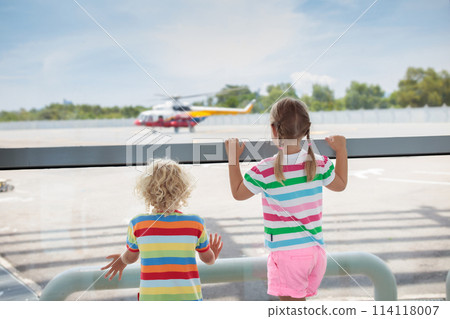 Kids travel and fly. Child at airplane in airport 114118007