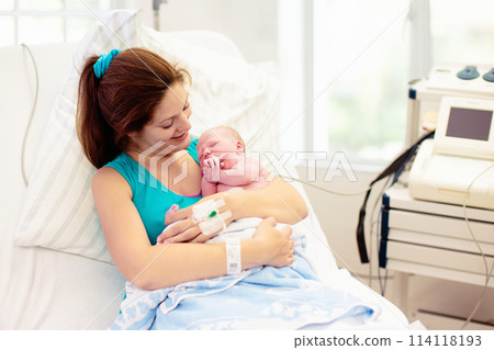 Young mother giving birth to a baby Young mother giving birth to a baby 114118193