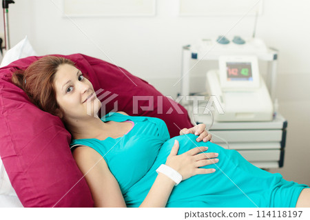Young mother giving birth to a baby 114118197