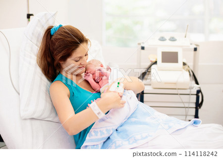 Young mother giving birth to a baby Young mother giving birth to a baby 114118242