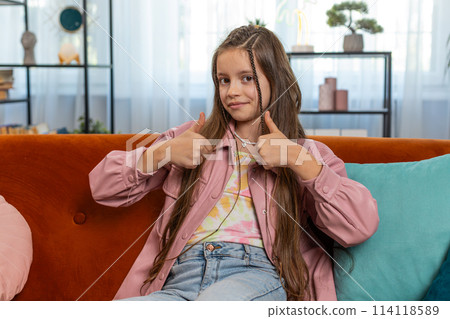 Child girl kid looking approvingly at camera showing double thumbs up like sign positive feedback Child girl kid looking approvingly at camera showing double thumbs up like sign positive feedback 114118589