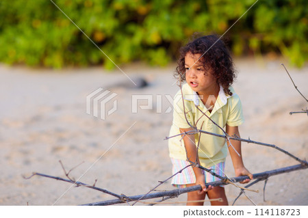 Little boy playing on tropical beach. Little boy playing on tropical beach. 114118723