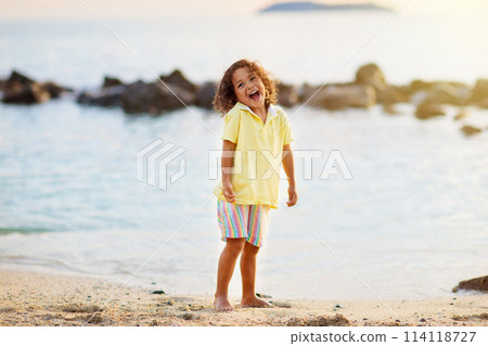 Little boy playing on tropical beach. 114118727