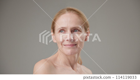 Anti age, Beauty, health and dry skin care real people concept - beautiful middle-aged mature Caucasian woman in her 50s looking at the camera with a slight smile Anti age, Beauty, health and dry skin care real people concept - beautiful middle-aged mature Caucasian woman in her 50s looking at the camera with a slight smile 114119033