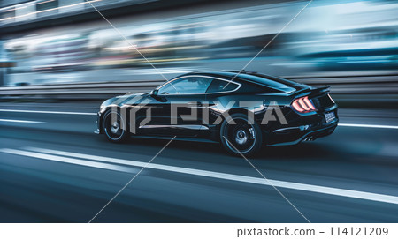 Back side view tracking shot of a car speeding on empty street. Back side view tracking shot of a car speeding on empty street. 114121209