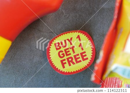 buy 1 get 1 free offer sticker and prodcuts on table buy 1 get 1 free offer sticker and prodcuts on table 114122311