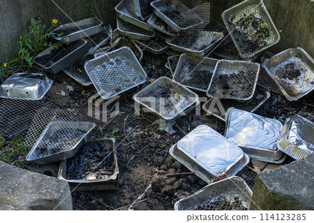 Many Disposable Grills, Used Grill Piles, Barbecue Garbage with Foil Pans, Human Waste 114123285