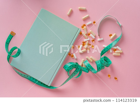 Weight Loss Pills and Measuring Tape, Diet Supplements Capsules, Obesity Lose Tablets, Color Drugs Pile Weight Loss Pills and Measuring Tape, Diet Supplements Capsules, Obesity Lose Tablets, Color Drugs Pile 114123319