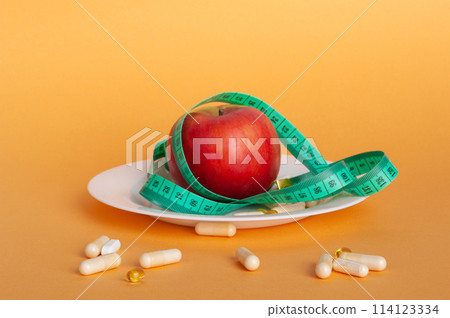 Weight Loss Pills and Measuring Tape, Diet Supplements Capsules, Obesity Lose Tablets, Color Drugs Pile 114123334