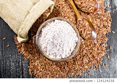Flour red rice in bowl on board top Flour red rice in bowl on board top 114124238