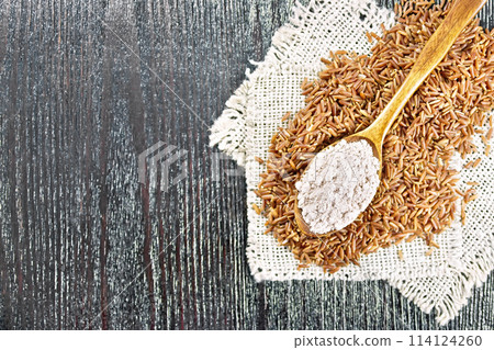 Flour red rice in spoon on board top 114124260
