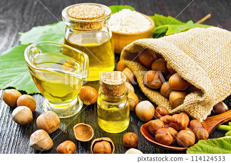 Oil hazelnut in vial on board Oil hazelnut in vial on board 114124533