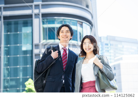 Business people standing in an office district Business people standing in an office district 114125062