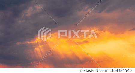 Sunshine In Sunrise Bright Dramatic Sky. Sun Ray Through Dark Rainy Clouds. Scenic Colorful Sky At Dawn. Sunset Sky Natural Abstract Background. Panorama Sunshine In Sunrise Bright Dramatic Sky. Sun Ray Through Dark Rainy Clouds. Scenic Colorful Sky At Dawn. Sunset Sky Natural Abstract Background. Panorama 114125546