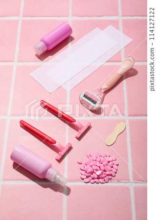 Accessories for depilation on a pink background Accessories for depilation on a pink background 114127122