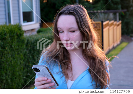 Young women are watching smartphones with stress. Online communication that is not happy is not successful. 114127709