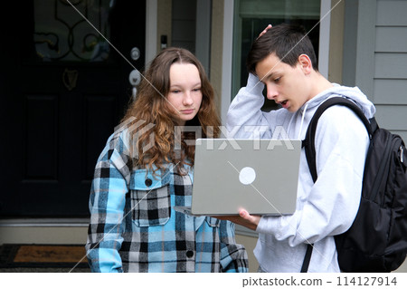 do homework together peep boy and girl sit next in tracksuits and plaid girl smiles turns boy helps finds mistakes straightens hair desire likes help friend School years Classmates teenagers do homework together peep boy and girl sit next in tracksuits and plaid girl smiles turns boy helps finds mistakes straightens hair desire likes help friend School years Classmates teenagers 114127914