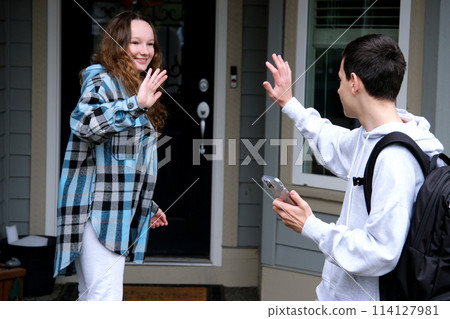 boy brought girl home teen are friends with briefcase on back high school pleasant relationship First love communication desire to be together parting smile see you tomorrow school time adolescence boy brought girl home teen are friends with briefcase on back high school pleasant relationship First love communication desire to be together parting smile see you tomorrow school time adolescence 114127981