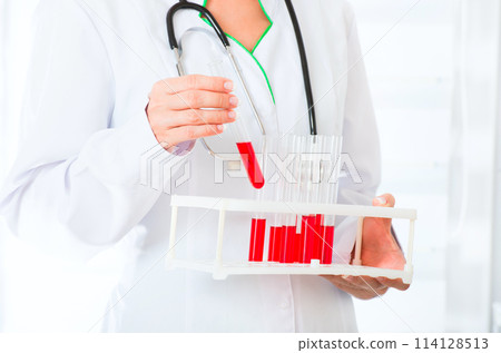 Doctor's hands with test tubes Doctor's hands with test tubes 114128513