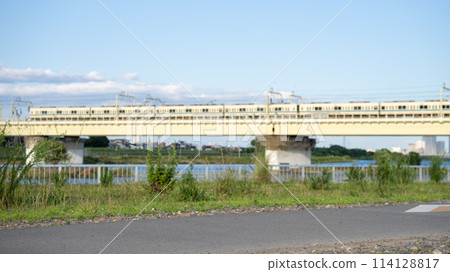 Train crossing the Tamagawa Iron Bridge 114128817