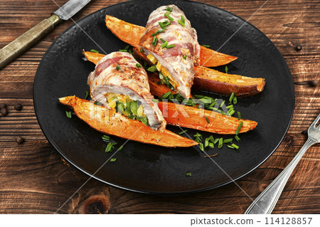 Homemade meat roll and roasted sweet potatoes. 114128857