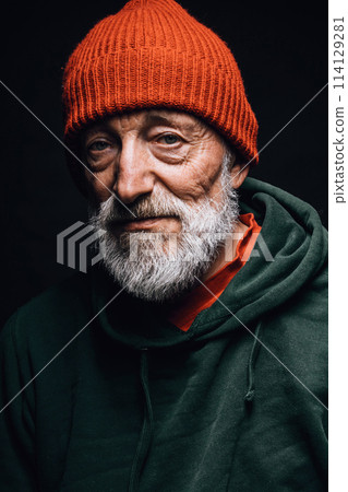 Portrait old grey-bearded fishman with wrinkled weathered face, puffy sad eyes 114129281
