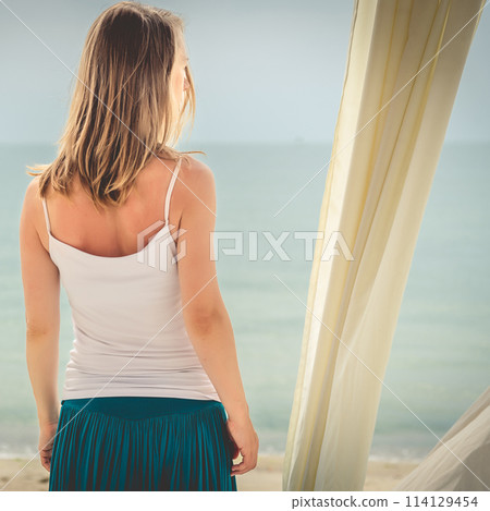Woman staying at the sea 114129454