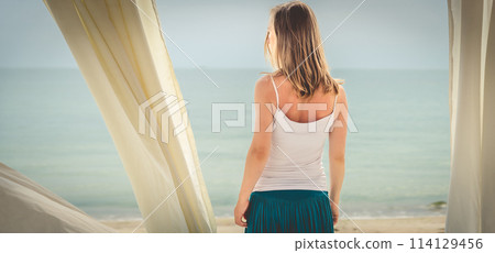 Woman staying at the sea Woman staying at the sea 114129456